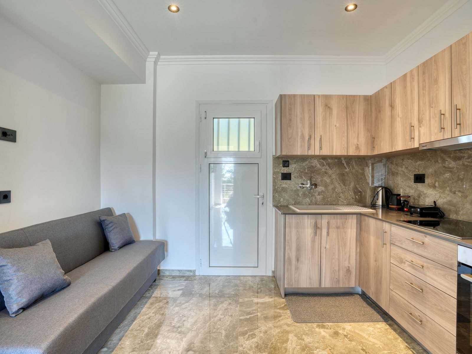 Garden View Apartment — living area and kitchen