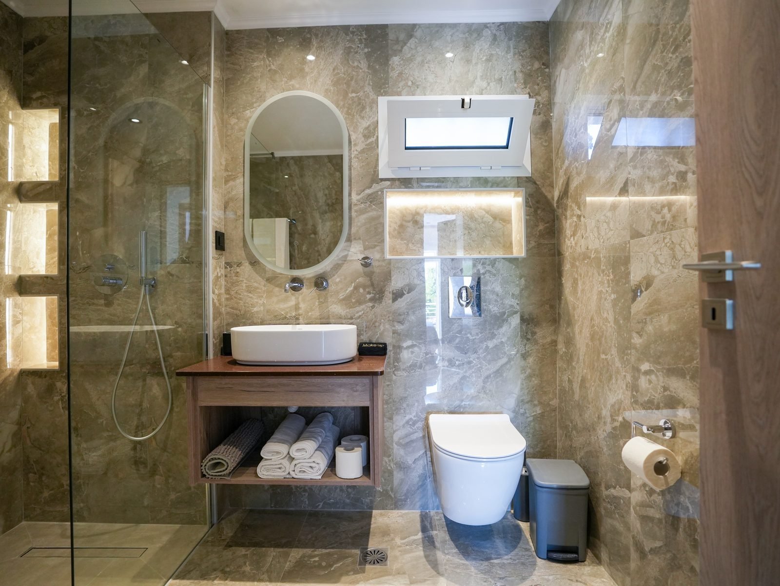Large modern marble bathroom with walk-in shower