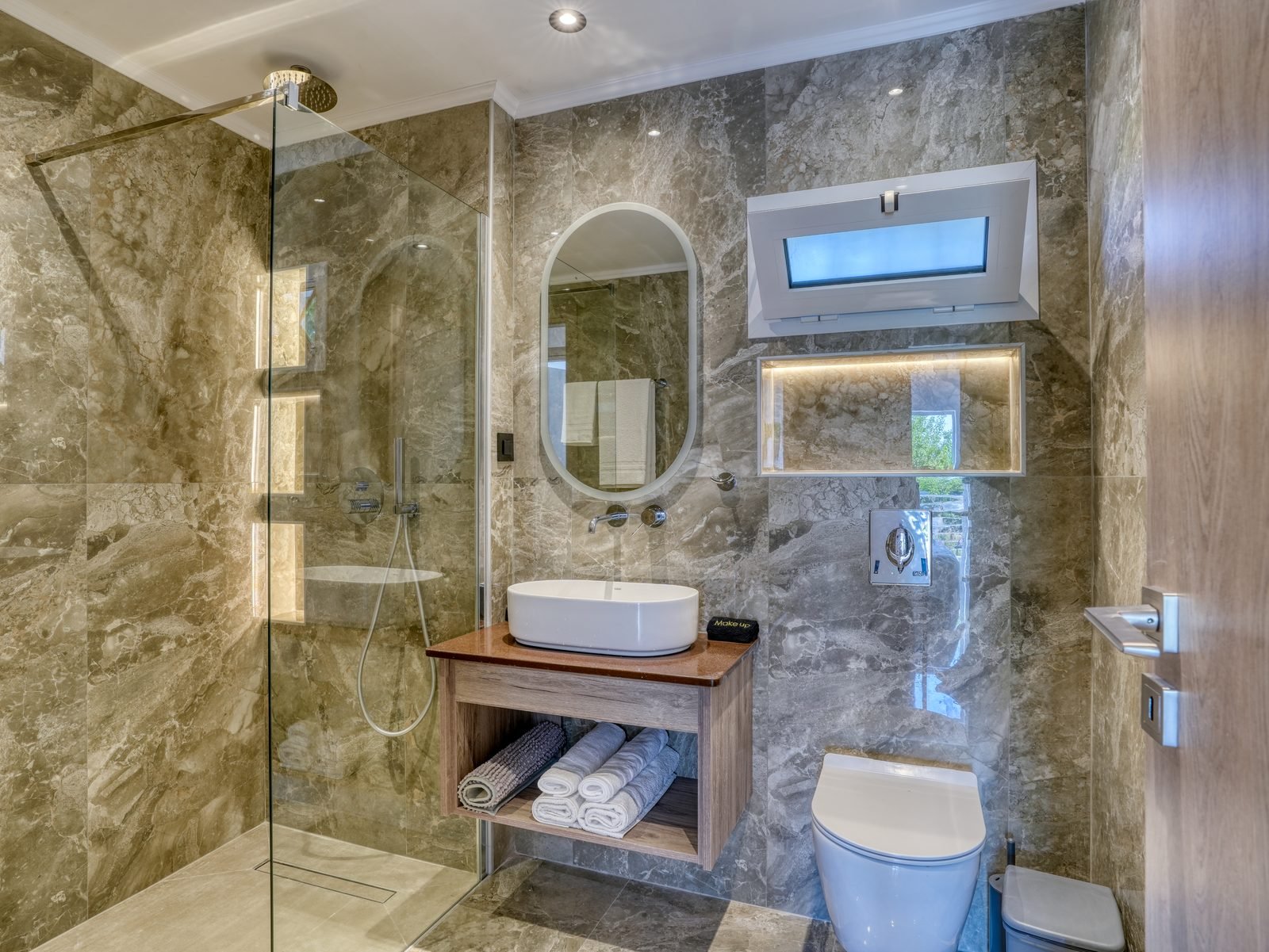 Sea View Apartment — modern marble bathroom